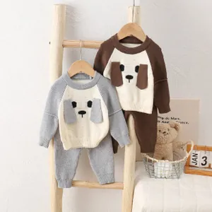 Detail view of baby boy knitted set featuring cute 3D cartoon dog ear decorations