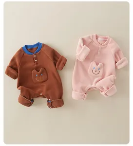Detail view of double-sided fleece baby rompers with cute pockets and snap closures