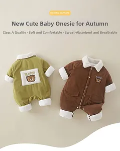 Detail of corduroy baby rompers with fleece trim and bear embroidery in avocado and tan