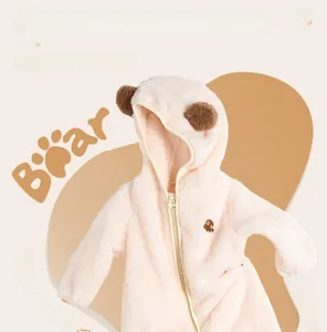 Detailed close-up of soft double-sided fleece baby romper with bear embroidery and hood