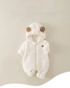 Detail of soft fleece newborn romper with cute bear ears and front zipper closure