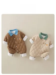 Quilted baby rompers with smile embroidery and ribbed cuffs in brown and beige colors