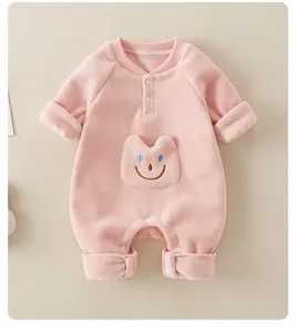 Detailed view of pink fleece baby romper with a cute animal pocket and snap buttons