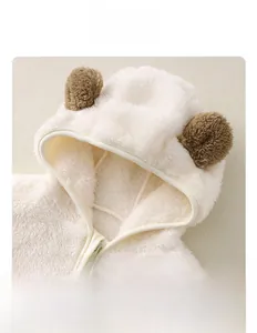 Detail of baby winter flannel romper showing soft plush hood and cute bear ears