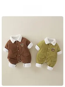 Close-up of baby corduroy romper featuring warm sherpa fleece lining and bear embroidery