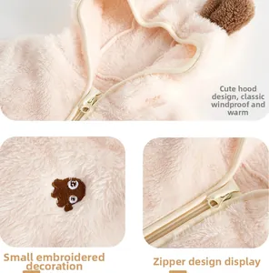 Detail view of pink fleece baby romper with bear embroidery and protective zipper hooded neck