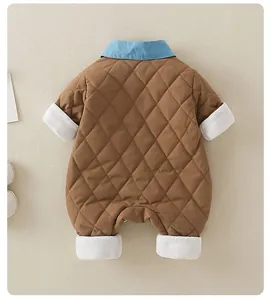 Detail view of quilted brown baby romper featuring soft plush cuffs and a contrast collar