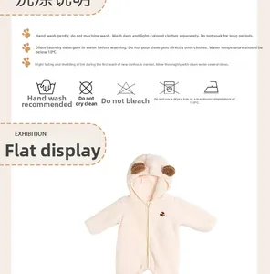 Detail of fleece newborn romper with teddy bear embroidery and cute ear hood design