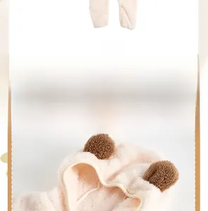 Detail of pink newborn fleece romper featuring soft plush texture and cute animal ears hood