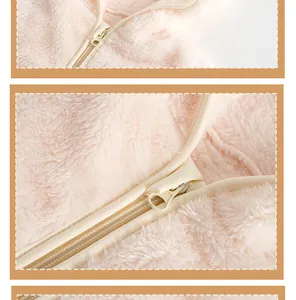 Detailed close-up of pink fleece baby romper zipper and soft velvet texture
