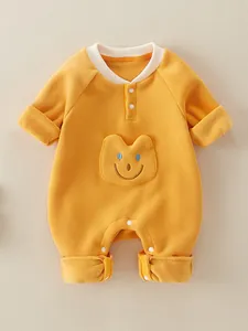 Soft yellow fleece baby romper with cute bear face pocket and snap buttons for infants