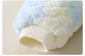 Detailed macro view of colorful plush baby romper sleeve with elastic ribbed cuff