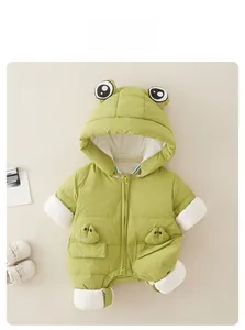 Detail of green frog-themed baby winter romper with quilted fabric and hood eyes