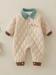 Quilted cotton baby romper with smile embroidery and green collar for winter comfort