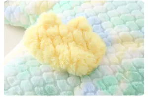 Macro view of colorful popcorn fleece baby winter romper with soft yellow plush detail