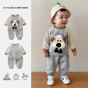 Detail of grey cotton toddler tracksuit with striped sleeves and cartoon dog embroidery