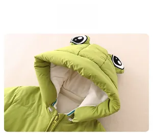 Detail of green baby winter jumpsuit with frog hood and warm fleece lining
