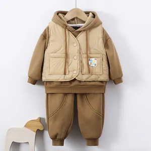 Detailed view of baby girl three-piece winter set with quilted vest and hooded sweatshirt