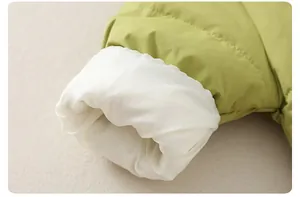 Detail of green quilted down suit showing white elastic windproof cuffs for infants