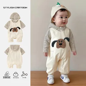 Detail view of cotton baby bodysuit with brown cartoon dog patch and striped sleeves