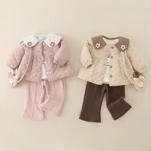 Close-up of quilted heart texture and floral collar detail on warm winter jackets