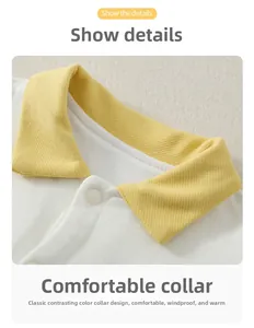 Detail of baby cotton jumpsuit featuring a yellow contrast collar and snap buttons