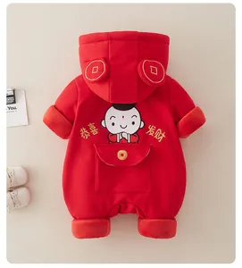 Detail of red baby romper featuring festive embroidery and thick fleece texture