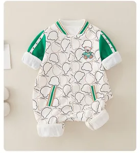 Detail of baby romper featuring bear embroidery, happy bear prints and snap button closure