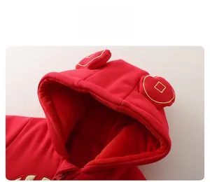 Detail of red baby winter romper hood with cute ears and golden coin embroidery