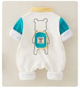Detail view of cotton baby romper featuring a cute bear outline and 3D mini backpack deco
