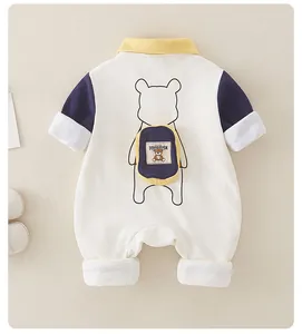 Detail of baby romper with 3D decorative backpack and cute cartoon bear print on back