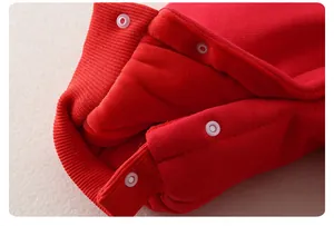 Close-up of red baby winter romper featuring snap buttons and warm fleece lining