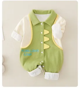 Detail of baby romper featuring green waffle knit fabric and cute dinosaur accents