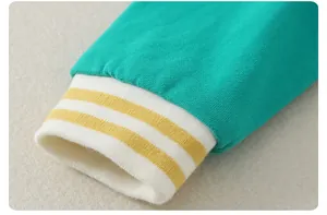 Detailed macro view of the striped rib knit cuffs on the cotton baby romper jumpsuit