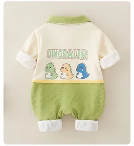 Back view of long sleeve baby romper with green waffle texture and dinosaur print