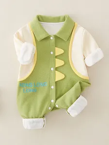 Green and white cotton dinosaur baby romper with 3D fins and waffle texture