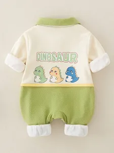 Infant cotton romper with green collar and cute dinosaur print on a cream white background