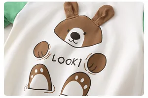 Detail of baby cotton bodysuit featuring a 3D bear print and breathable mesh fabric