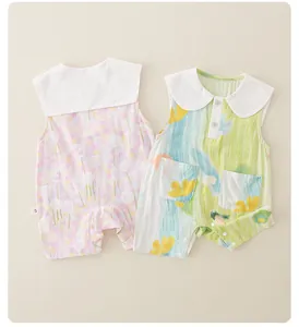 Flat lay of newborn baby girl summer cotton rompers featuring floral and doodle patterns