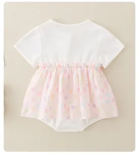 Detail of baby summer cotton bodysuit dress featuring pink balloon prints and ruffles
