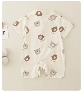 Detailed flat lay of a cotton baby romper featuring cute bear prints and a lapel collar