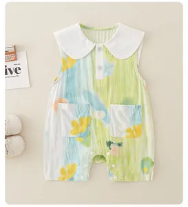 Detail of baby cotton romper with Peter Pan collar and colorful watercolor prints