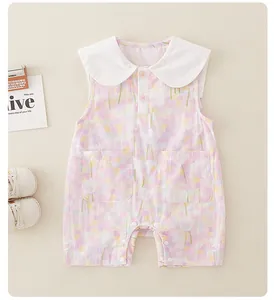 Detail of baby floral cotton romper with Peter Pan collar and two front pockets