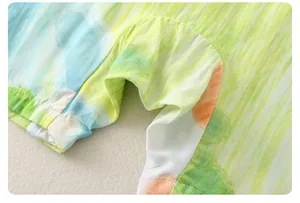 Detail of soft cotton baby romper fabric with artistic colorful tie-dye print patterns