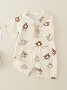 Short sleeve cotton baby romper with cute bear print and beige bowtie detail