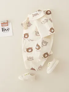 Newborn baby cotton bodysuit with brown bear print and matching soft sole shoes