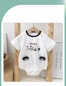 Close-up of white cotton baby romper featuring a cute panda print and 3D paw details