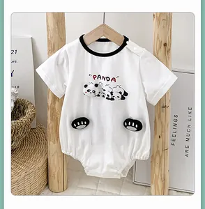 Detail of white cotton baby bodysuit with panda print and 3D paw-shaped pockets