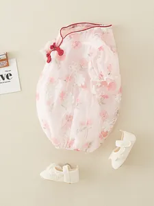 Baby girl pink floral bodysuit with traditional knot and matching lace shoes