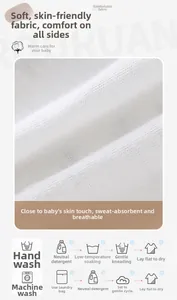 Macro detail of breathable soft cotton baby fabric with washing and care instructions